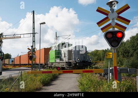 Container Train passing a road crossing in Göteborg harbor, Sweden Stock Photo