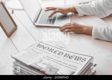 Stack of newspapers on table, closeup Stock Photo
