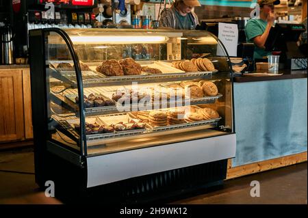 Baked goods, cookies and pastries in a lighted display case in a farm market our country store in Pike Road Alabama, USA. Stock Photo