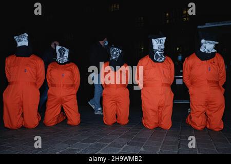 London, UK, 8th Dec, 2021, 'Kill the Bill' protesters in prison outfits and printed hoods displaying BLM, Animal Rebellion, HS2, Palestine Action and the Roma Chakra wheel. They gathered in Westminster as the third reading of the Police, Crime, Sentencing and Courts Bill (PCSC) got underway in the House of Lords. The new legislation, if passed, will grant police additional powers to crack-down on protest and the breaking-up of demonstrations deemed as causing 'serious annoyance'. Credit: Eleventh Hour Photography/Alamy Live News Stock Photo