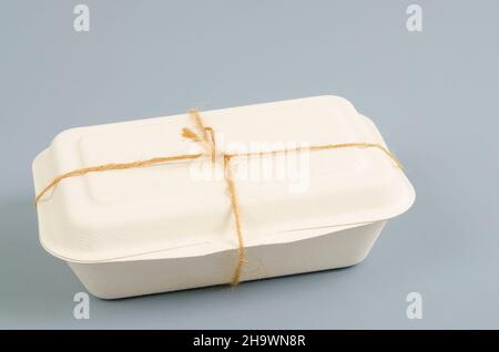 Eco friendly fast food biodegradable containers from recycle paper on grey background. Stock Photo