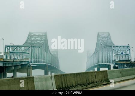 The twin bridges of the Crescent City Connection are pictured on a foggy morning, Dec. 7, 2021, in New Orleans, Louisiana. Stock Photo