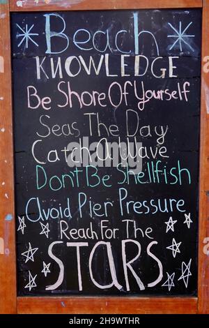 Summer written on a chalkboard at the beach Stock Photo - Alamy