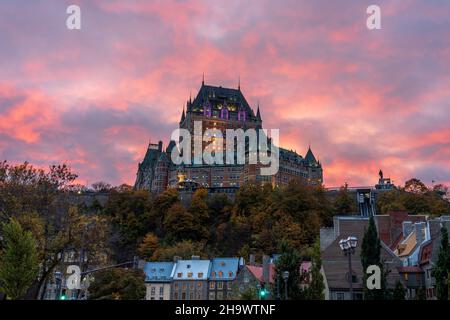 Quebec City Old Town street view in autumn dusk, stunning pink and yellow clouds over the sky in evening. Stock Photo