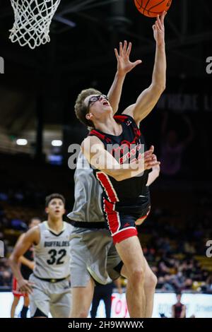 Boulder, CO, USA. 08th Dec, 2021. Eastern Washington Eagles forward Casey Jones (31) puts up a layup in the men's basketball game between Colorado and Eastern Washington at the Coors Events center in Boulder, CO. CU escaped 60-57. Derek Regensburger/CSM/Alamy Live News Stock Photo