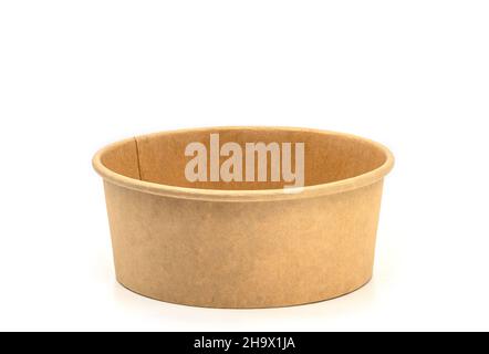 Close up empty delivery paper food box, brown box with round shape, front view image, blank space on the box, the isolated image on white background. Stock Photo