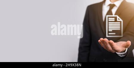 Hand holding a document icon in his hand Document Management Data System Business Internet Technology Concept. Corporate data management system DMS. Stock Photo
