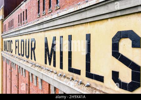 Baltic flower mills sign made from ceramic tiles on the wall of the Baltic arts centre and gallery gateshead tyne & wear Stock Photo