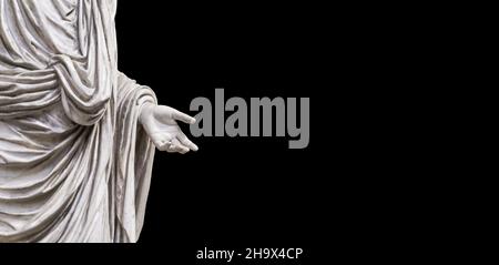 Hand holding antique statue on blank black background. Roman classical sculpture in marble with outstretched hand. Knowledge, education, training, charity concept. High quality photo Stock Photo