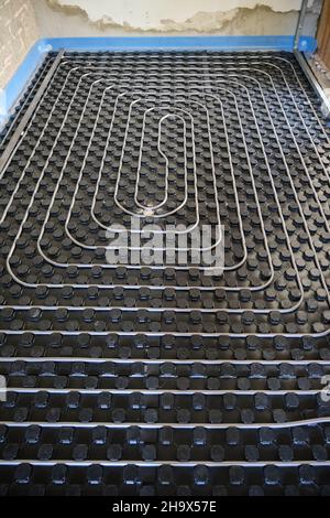 Radiant floor heating and cooling installation. Stock Photo