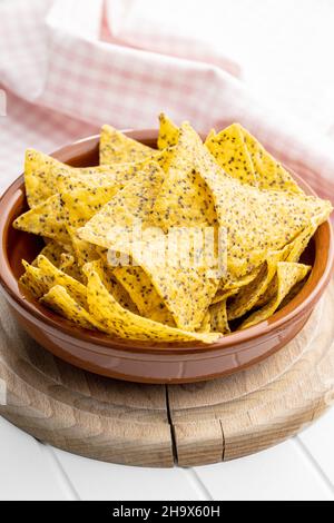 Salted tortilla chips triangle with chia seeds in bowl. Stock Photo