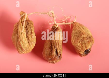 figs dried on a pink background. Creative minimalist style. healthy food Stock Photo