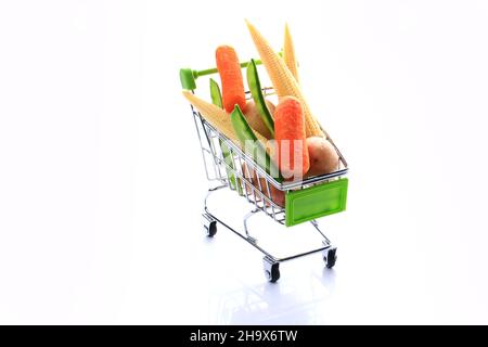 set of vegetables in a grocery basket isolated on white background. Corn, potatoes, peas. Healthy food Stock Photo