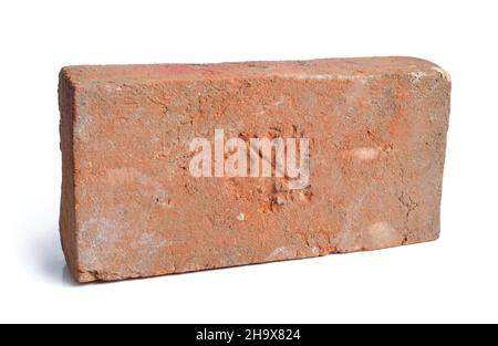 Antique brick with a stamp. Isolated. Stock Photo