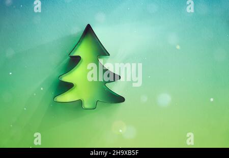 Green Christmas Background with Traditional Fir Tree Decoration and Text space. Glowing Sparkles of Winter Holidays. Merry Xmas and Happy New Year.