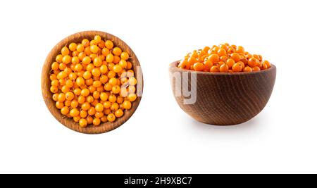 Sea buckthorn. Seabuckthorn in a wooden bowl isolated on white. Fresh ripe berry with leaves isolated on white background. Orang berry on white. Stock Photo