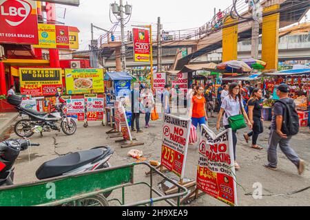 MANILA, PHILIPPINES - JANUARY 20, 2018: View of busy street in Pasay City, near EDSA LRT station. Stock Photo