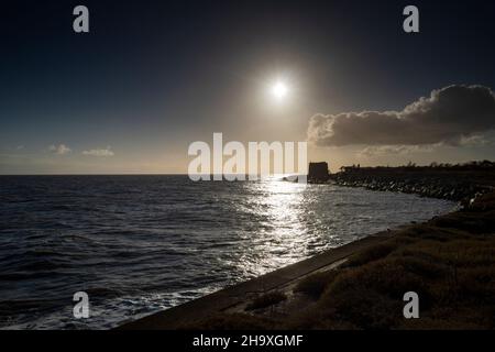 Winter sun low in the sky, East Lane, Bawdsey, Suffolk, England. Stock Photo
