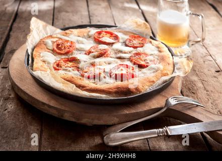 Margherita pizza and beer Stock Photo