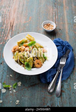 Pasta salad with prawns and pesto Stock Photo