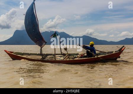 BAKO, MALAYSIA - MARCH 6, 2018: Small sailboat near Bako national park on Borneo island, Malaysia Stock Photo