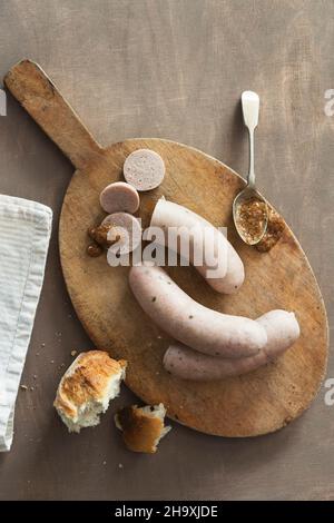 White sausage with sweet mustard and a roll Stock Photo