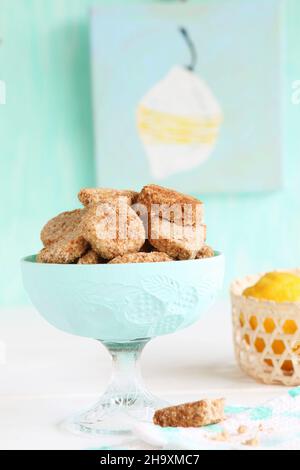 Gluten-free cookies with buckwheat flour and coconut blossom sugar, with lemons in a basket Stock Photo