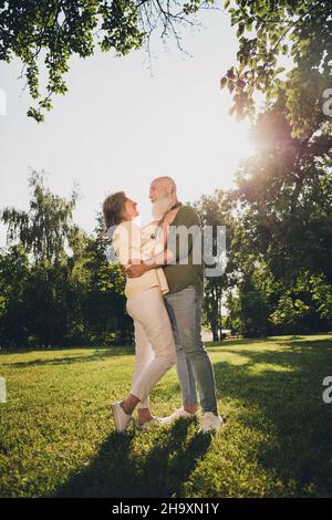 Photo of nice young couple hug wear white shirt isolated on grey color ...