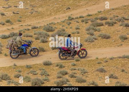 DARVAZA, TURKMENISTAN - APRIL 19, 2018: Motorcycle riders near Darvaza Derweze gas crater in Turkmenistan Stock Photo