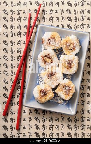 chocolate and banana maki with grated coconut Stock Photo