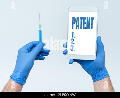 Text showing inspiration Patent. Business showcase government authority or licence conferring a right or title Research Scientist Presenting New Stock Photo