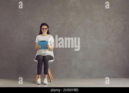 Woman is waiting for an interview, fills out a questionnaire. Stock Photo