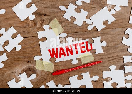 Handwriting text Wanted. Conceptual photo Desire something Wish want Hoping for Somebody being searched Building An Unfinished White Jigsaw Pattern Stock Photo