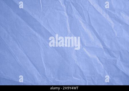 an empty wrinkled tissue paper textured background In Color of the year 2022 very peri dynamic vibrant periwinkle blue violet Stock Photo