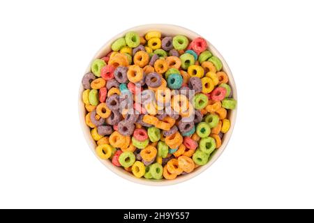 Colorful rings cereal spill out into a bowl. Breakfast. Isolated on a white background. Stock Photo