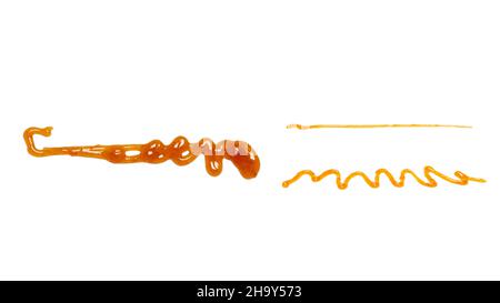 Orange apricot jam splashes isolated on white background. Top view. Stock Photo