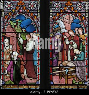 A stained glass window by Frederick Preedy depicting Raising of Lazarus, and the Son of the Widow of Nain, St Edmund's Church, Hunstanton, Norfolk Stock Photo