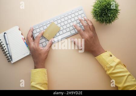 man hands holding credit card and using laptop shopping online  Stock Photo