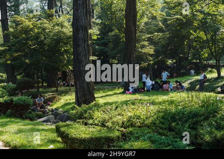 Pyongyang, North Korea - July 27, 2014: Moranbong Park. North Korean people relax in the park on the weekend. Stock Photo