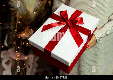 Present held in womans hand. Merry Christmas and Happy New Year concept Stock Photo