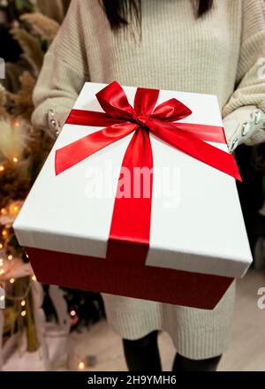 Present held in womans hand. Merry Christmas and Happy New Year concept Stock Photo