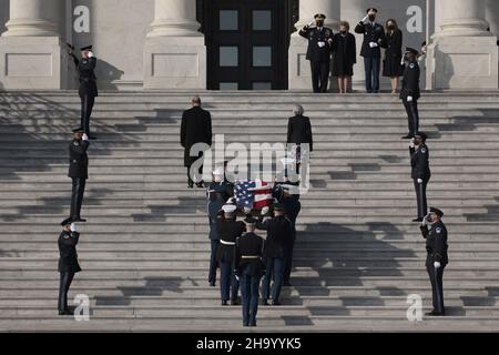 A joint services military honor guard carries the casket containing the remains of the late Sen. Robert Dole (R-KS) up the steps of the U.S. Capitol on December 09, 2021 in Washington, DC. The former Senate Majority Leader and Republican Presidential nominee, will lie in state in the Capitol Rotunda all day before his funeral service at the National Cathedral. Photo by Anna Moneymaker/Pool/ABACAPRESS.COM Stock Photo