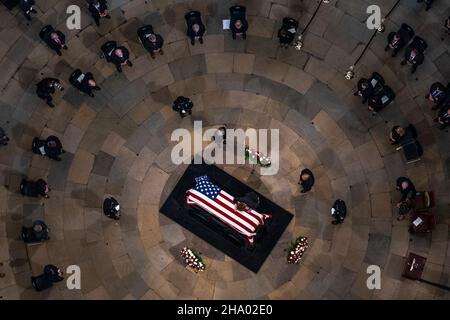 Elizabeth Dole lays across the casket of her husband, former Sen. Bob Dole, R-Kan., as he lies in state in the Rotunda of the U.S. Capitol, Thursday, Dec. 9, 2021, on Capitol Hill in Washington.Credit: Andrew Harnik/Pool via CNP /MediaPunch Stock Photo