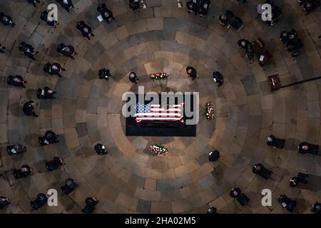 Elizabeth Dole lays across the casket of her husband, former Sen. Bob Dole, R-Kan., as he lies in state in the Rotunda of the U.S. Capitol, Thursday, Dec. 9, 2021, on Capitol Hill in Washington. Credit: Andrew Harnik/Pool via CNP /MediaPunch Stock Photo