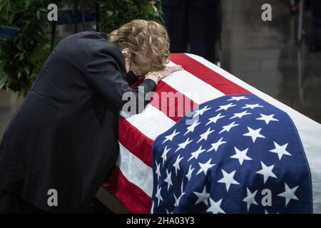 Washington, United States. 09th Dec, 2021. Elizabeth Dole lays across the casket of her husband, former Sen. Bob Dole, R-Kan., as he lies in state in the Rotunda during a Congressional memorial service in the Rotunda at the U.S. Capitol in Washington DC, on Thursday, December 9, 2021. Dole, who served on Capitol Hill for 36 years, died in his sleep on December 5 at the age of 98. Pool photo by Jabin Botsford/UPI Credit: UPI/Alamy Live News Stock Photo