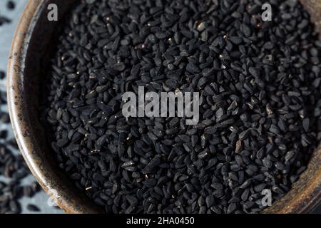 Raw Black Organic Charnushka Onion Seed Spice in a Bowl Stock Photo