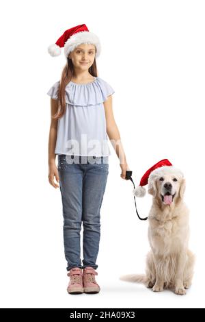 Child and a labrador retriever dog wearing christmas santa claus hats isolated on white background Stock Photo