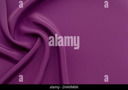 A piece of burgundy, violet, blue cloth. Fabric texture for background and design works of art, beautiful wrinkled pattern of silk or linen. A crumple Stock Photo