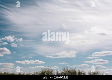 Wispy Clouds in Blue Sky Stock Photo