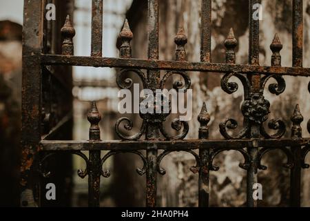 Up close, aged iron work around a tomb in New Orleans Stock Photo